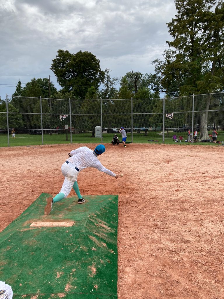 David Dekay demonstrates his submarine style pitching